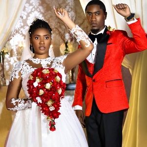 Red and gold tear drop bouquet with gold brooches